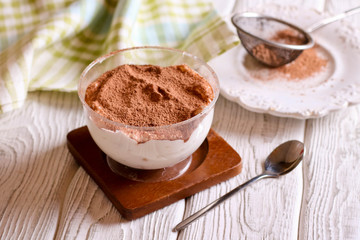 Tiramisu, traditional Italian dessert in glass