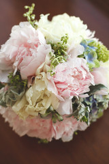 Beautiful wedding colorful bouquet for bride. Beauty of colored flowers. Close-up bunch of florets. Bridal accessories. Female decoration for girl. Details for marriage and for married couple