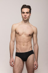 young man model posing shirtless body fit slim