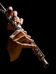 Flute in hands - music background