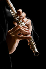 Flute in hands - music background