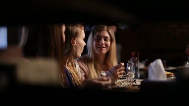 Group of girls meeting for lunch at restaurant