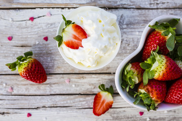 Strawberries with whipped cream, delicious dessert.
