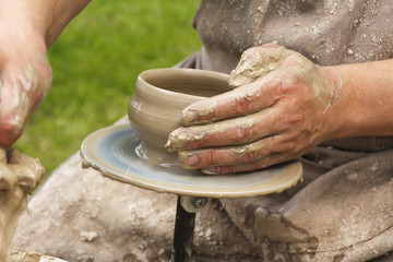 Close up of potter's hands