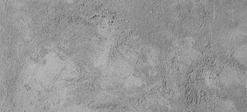Asphalt close-up, wet concrete wall texture. Raw plaster wall background.