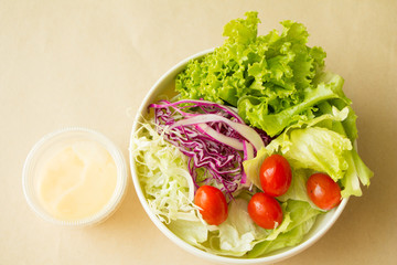 Vegetable salad and cream top view. copy space.