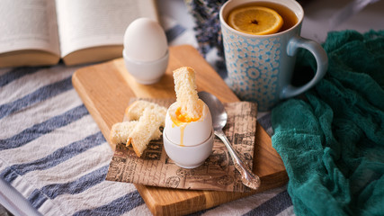 Fototapeta na wymiar freshly boiled white egg on wooden board. Healthy fitness breakfast