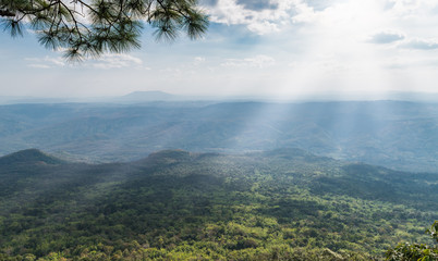 sunlight and sky with landscape and forest