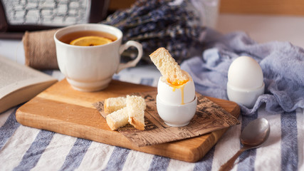 freshly boiled white egg on wooden board. Healthy fitness breakfast