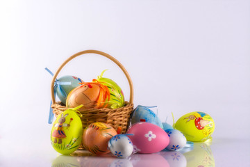 Easter eggs in the basket, isolated on white background.