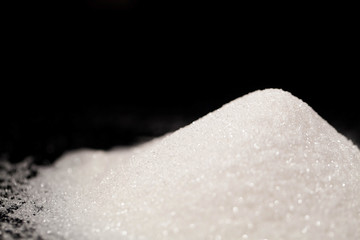 The sugar lies on the black background
