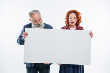 Couple holding blank card