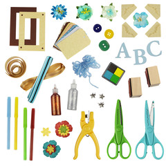 Collection of various scrapbooking or card making supplies, isolated on white background.