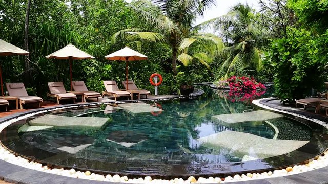 beach garden swimming pool,tropical paradise at Iruveli island, Maldives.