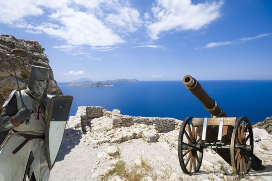 Medieval knight and artillery gun in ruins of a castle in Kritinia built by the Knights of Saint John, Rhodes, Greece