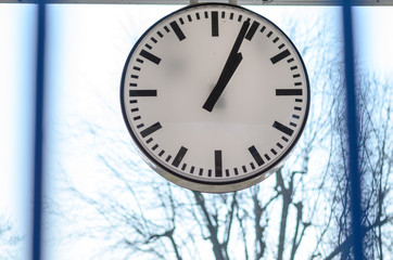 White clock against window