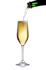 pouring champagne in a flute on white ground