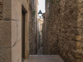 Narrow street in old town of Girona, Spain
