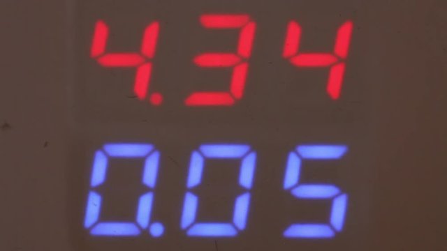 reading on the voltmeter screen. close-up