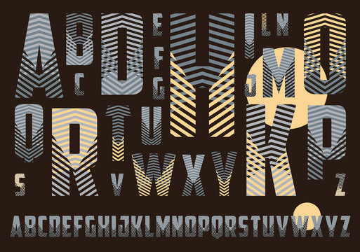 alphabet with crossing stripes pattern in dark brown and ivory