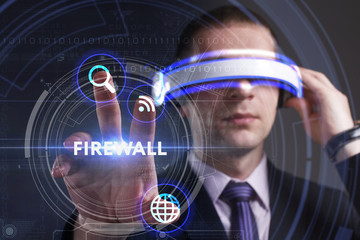 Business, Technology, Internet and network concept. Young businessman working in virtual reality glasses sees the inscription: Firewall