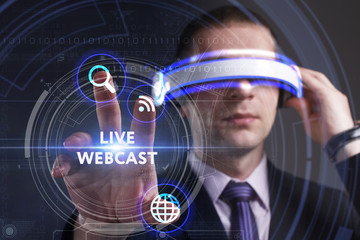 Business, Technology, Internet and network concept. Young businessman working in virtual reality glasses sees the inscription: Live webcast