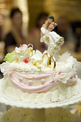 Obraz na płótnie Canvas Decoration on wedding cake figurine of the bride and groom on the cake