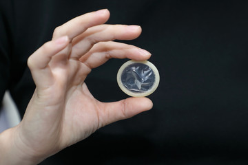 woman hold condom