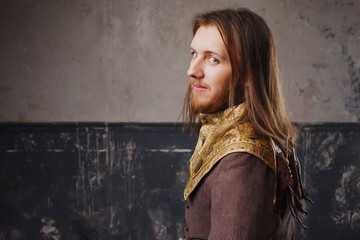 Fototapeta premium Handsome male Steam punk. Retro man in uniform, portrait over grunge background.