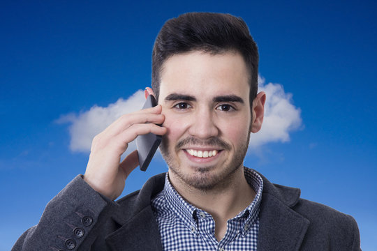 businessman smiling talking on mobile phone