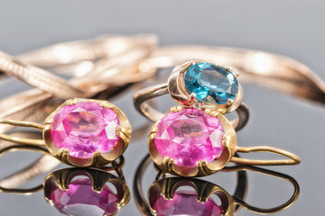 Gold ring with Topaz color London blue and earrings with large rubies