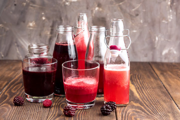 Bottle with fresh homemade berry lemonade with pulp