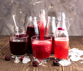 Bottle with fresh homemade berry lemonade with pulp