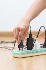 Woman unplugged plug to save on energy
