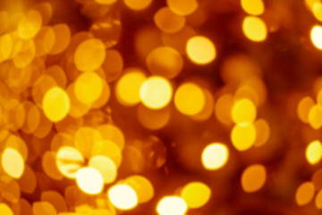 Fototapeta premium Golden Festive abstract background with bokeh defocused lights and black shadow