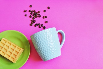 Breakfast in the cafe/ Cup of coffee and waffles on the green saucer