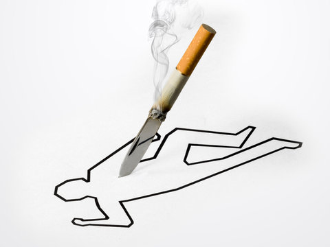 Knife, simulates a cigarette, digs into a silhouette of the body, on white background