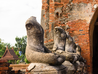 Fototapeta na wymiar Majestic ruins of 1629 Wat Chai Watthanaram built by King Prasat Tong with its principal Prang (center) representing Mount Meru, the abode of the gods