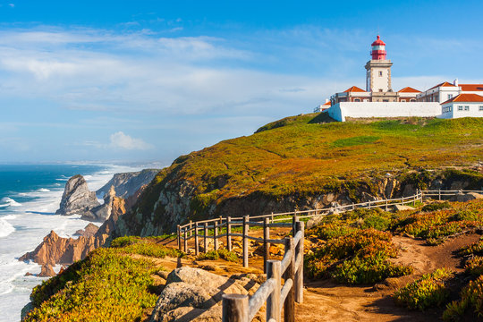 The lighthouse in Cabo da Roca. Cliffs and rocks on the Atlantic ocean coast in Sintra in a beautiful summer day, Portugal