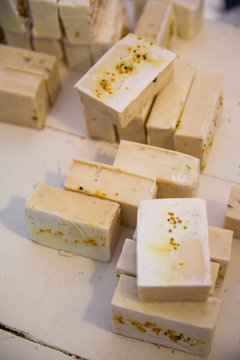 Soap bars on handmade soap workshop table