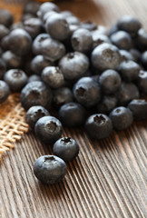 ripe sweet blueberries on wooden table