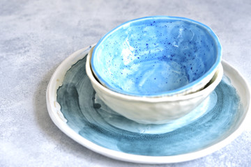Obraz na płótnie Canvas Craft glazed ceramic bowls of turquoise colors.