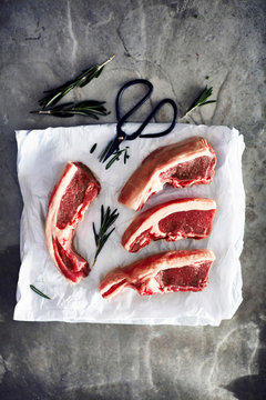 Lamb chops on greaseproof paper, overhead view