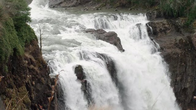 Top of Famous Massive Waterfall Raging with Misty Rain in Pacific Northwest