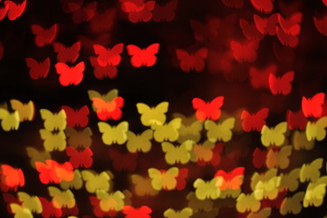Bokeh lights of red and yellow butterflies background