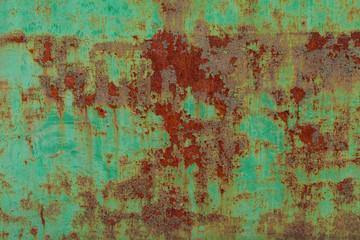 Rusty surface of green metal plate. Rusty texture backdrop. Rust on old metal. Rust on old green fence. Grunge ruststained metal fence. Mildew on green iron-plate fencing. Seedy bingery paling