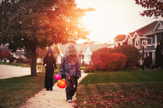 Friends dressed as witch and zombie