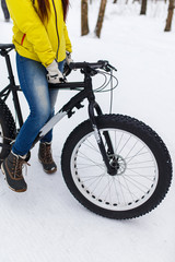 Girl in jeans on bicycle