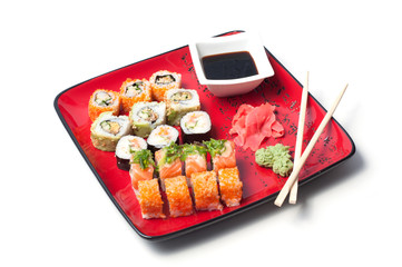 Sushi on a red plate with hieroglyph
