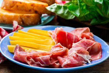 Prosciutto and mango.selective focus.